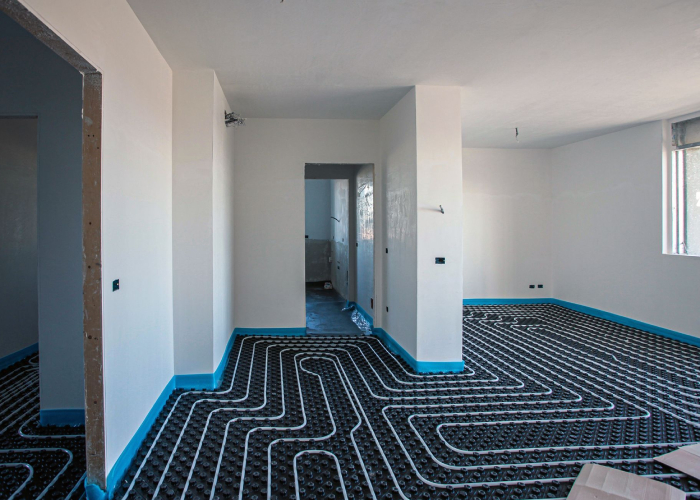 Plancher chauffant installé dans une maison par Geoffrey Porcheron pour diffuser une chaleur douce et homogène